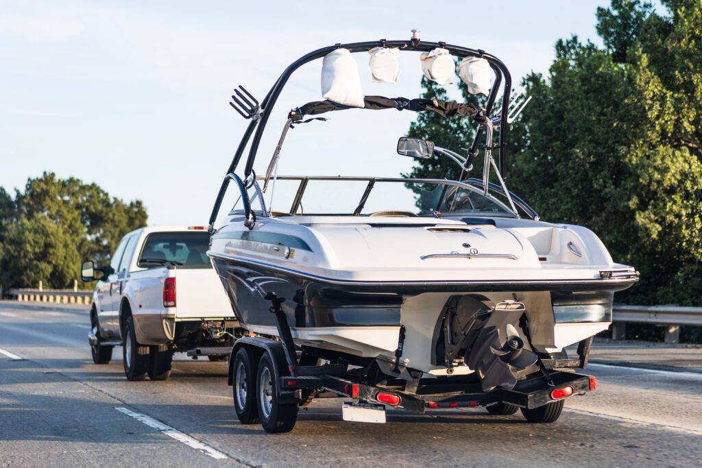 Semi-truck towing a boat