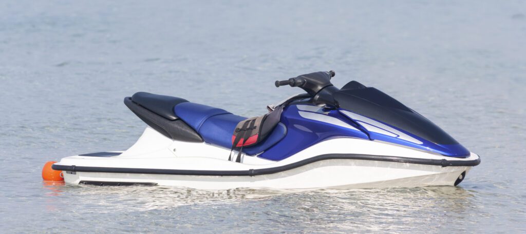 Close up of jet ski sitting on lake.