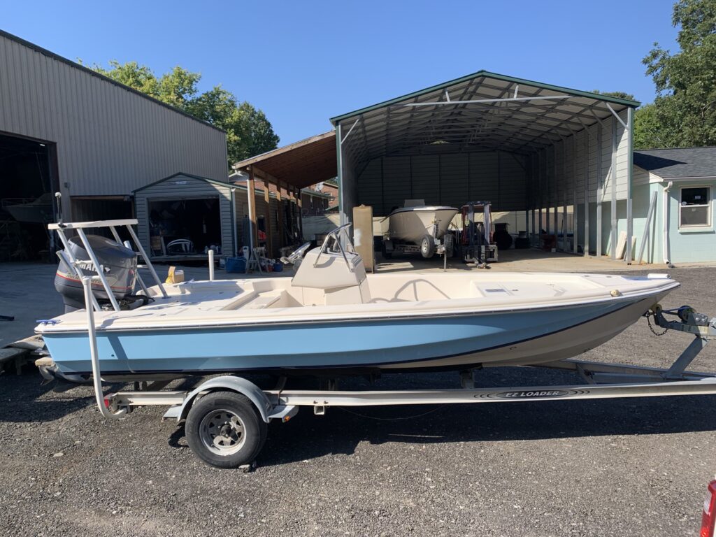 Scout 192 boat light blue paint, on trailer.